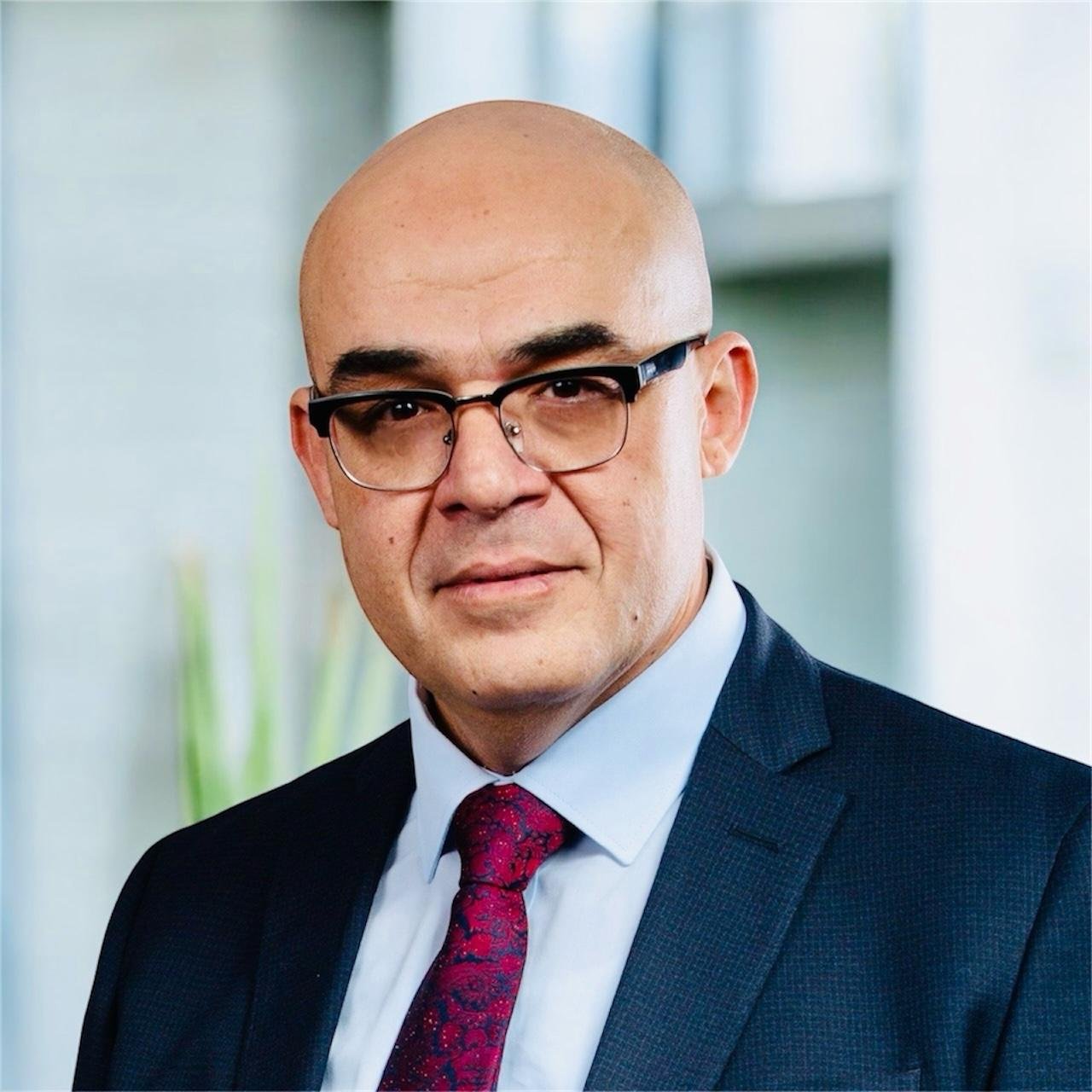 Image of Ayman Radwan, media technology expert in broadcast and digital transformation, leading a studio workflow discussion