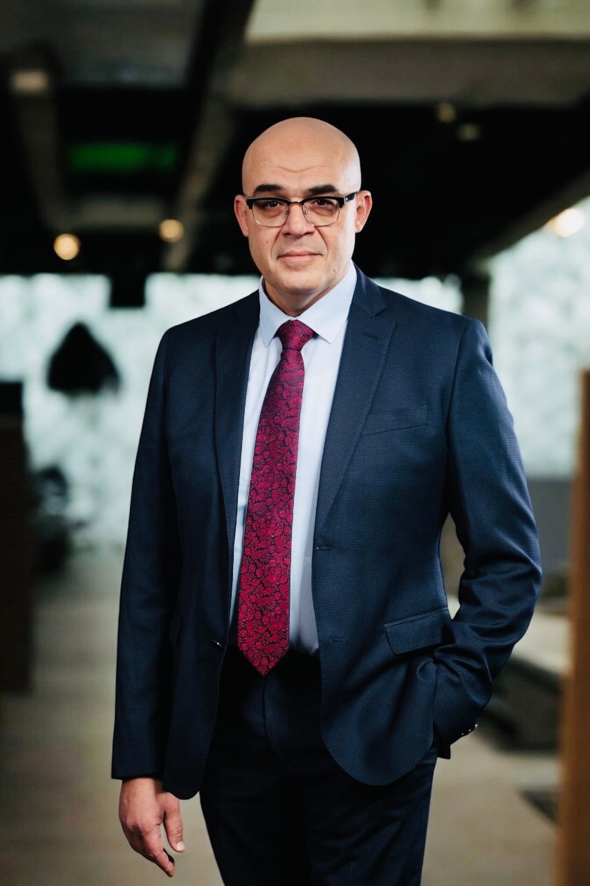 Image of Ayman Radwan, media technology expert in broadcast and digital transformation, leading a studio workflow discussion